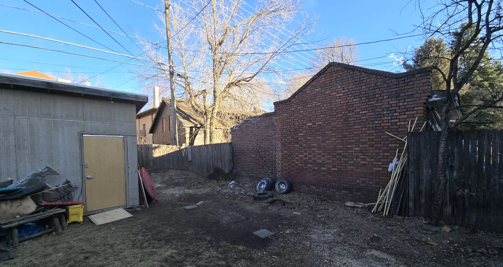 Same Northglenn backyard after Arbol De Fuego Services removed the tree, debris hauled and the yard raked